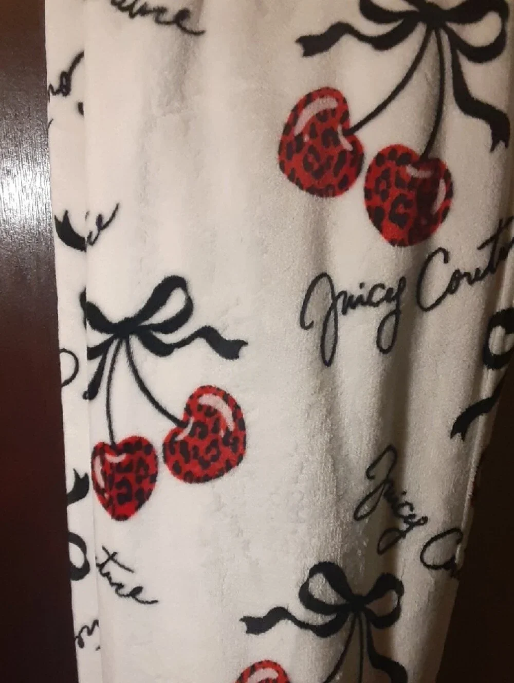 Full Queen Juicy Couture Plush Blanket in White with Red Cherries and Black Bows
